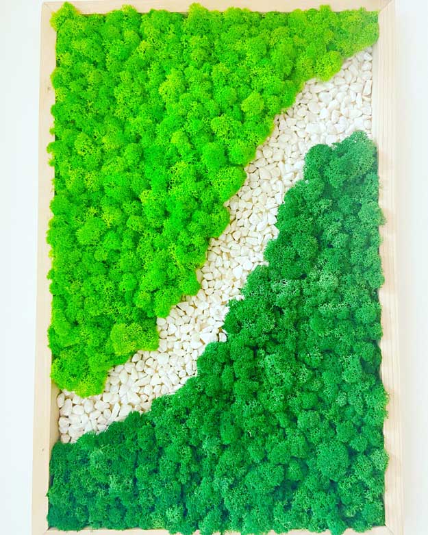 River rock wall art with moss